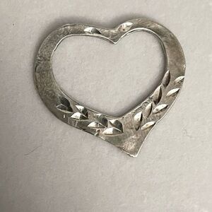 Two vintage sterling silver heart charms
SEE ALL PICS
